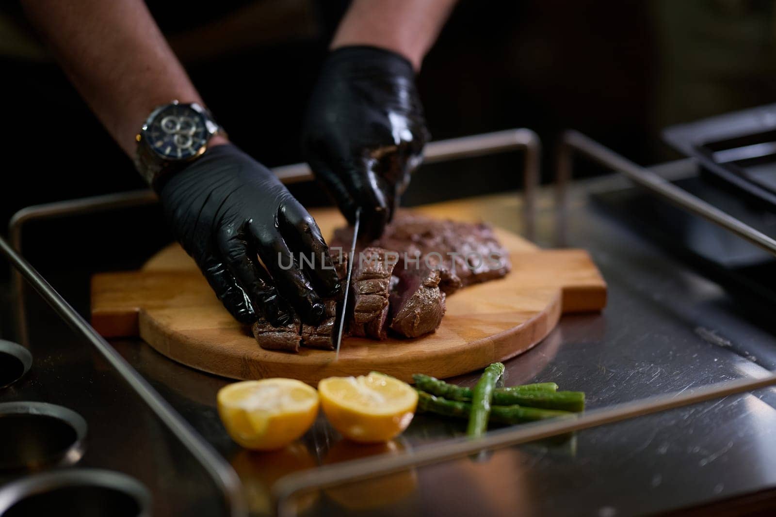 Close-up shot, a professional chef expertly prepares a delicious steak using modern cooking techniques, showcasing culinary excellence and precision in the art of gourmet cuisine.