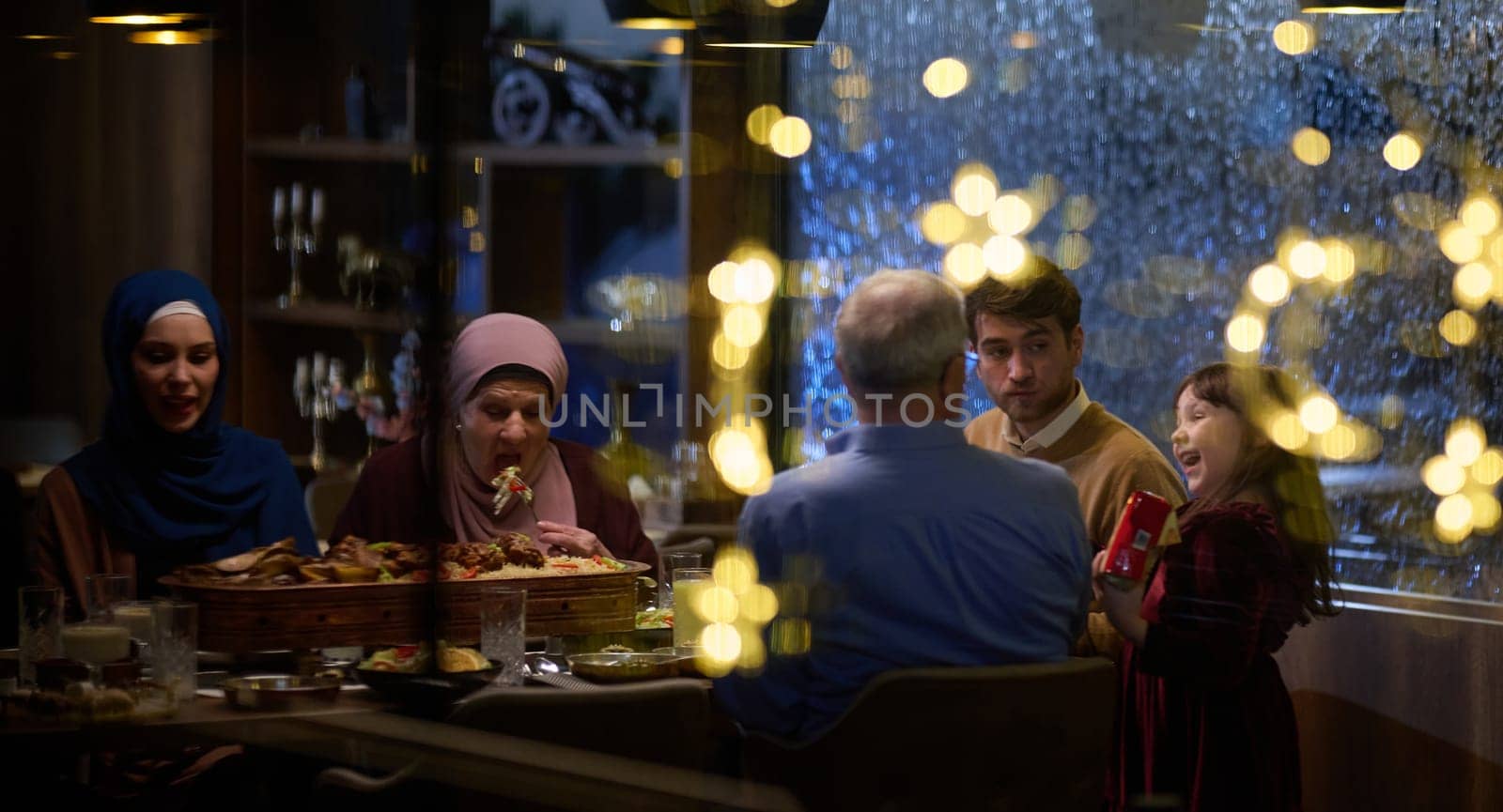 A modern and traditional European Islamic family comes together for iftar in a contemporary restaurant during the Ramadan fasting period, embodying cultural harmony and familial unity amidst a culinary celebration of diversity by dotshock