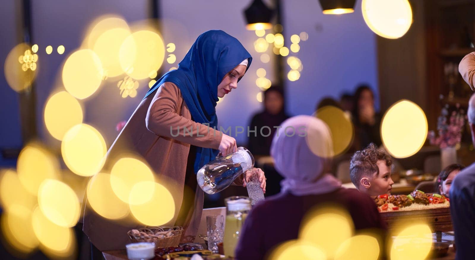 A modern and traditional European Islamic family comes together for iftar in a contemporary restaurant during the Ramadan fasting period, embodying cultural harmony and familial unity amidst a culinary celebration of diversity.