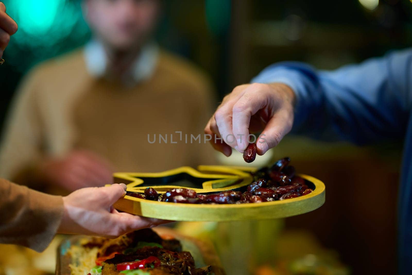 In this modern portrayal, a European Islamic family partakes in the tradition of breaking their Ramadan fast with dates, symbolizing unity, cultural heritage, and spiritual observance during the holy month of Ramadan by dotshock