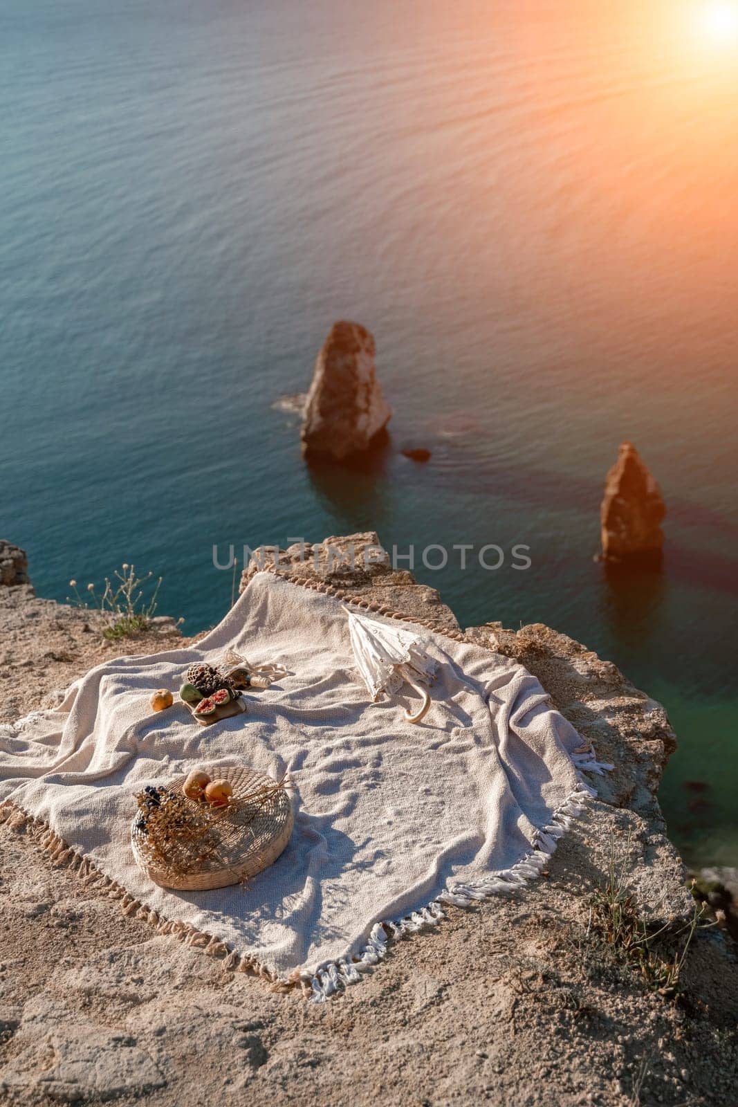 picnic on a hill overlooking the sea by Matiunina