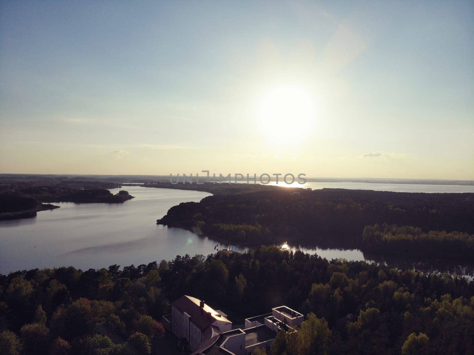 sunset over the park in the city. top view of the river