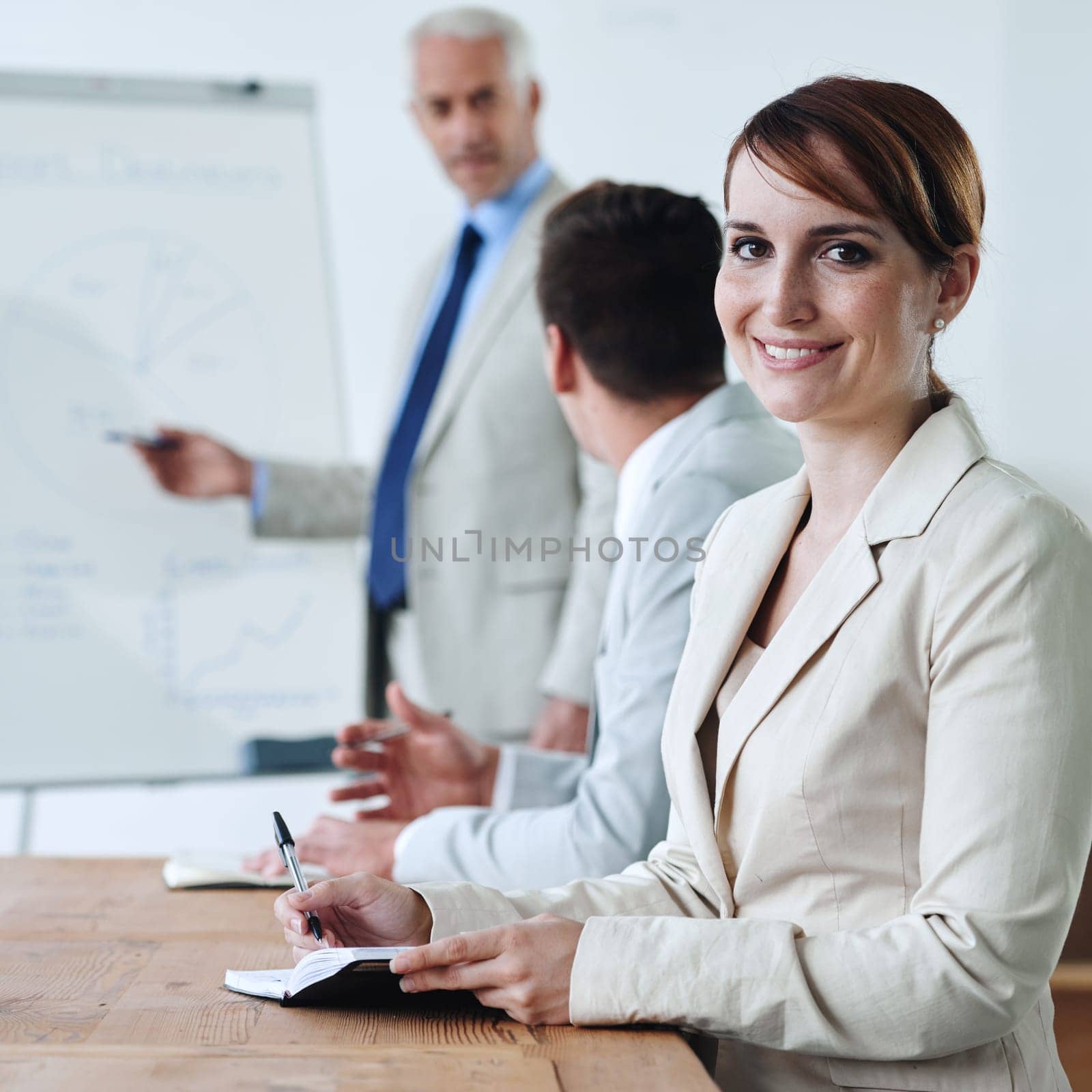Meeting, presentation and business woman in portrait, notes for planning with collaboration or corporate training session. Seminar, information and CEO with whiteboard, smile for team and strategy by YuriArcurs