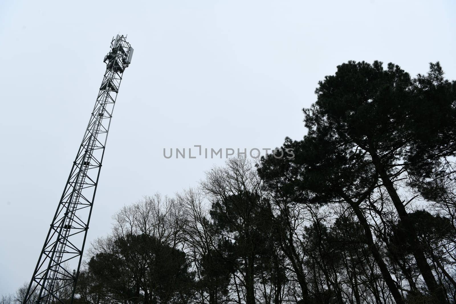 Deployment of the 5G network. Laying antennas on a mobile phone mast in the winter atmosphere. France, Gironde, February 2024 by FreeProd