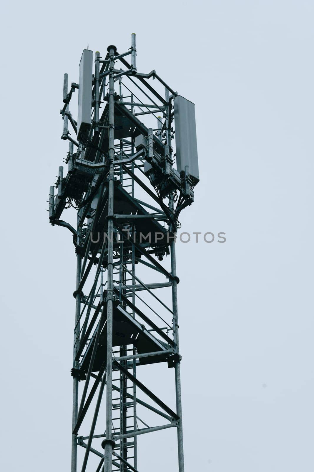 Deployment of the 5G network. Laying antennas on a mobile phone mast in the winter atmosphere. France, Gironde, February 2024 by FreeProd