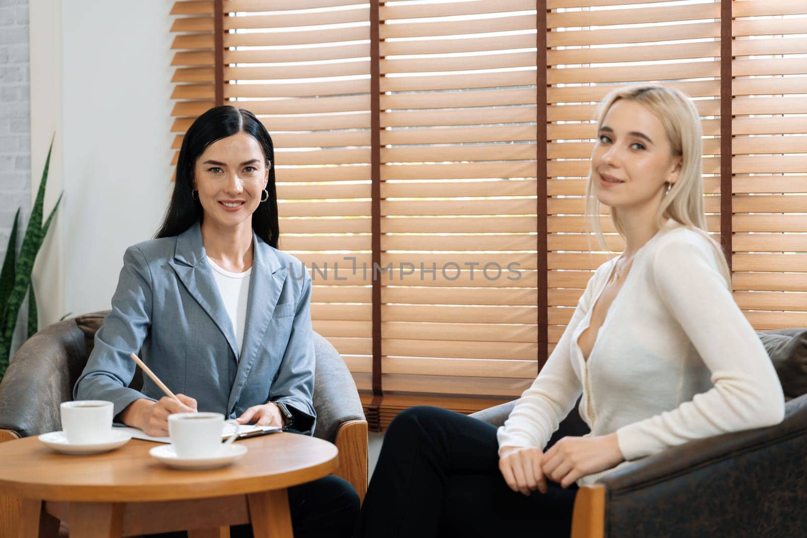 Psychological consultation gaining improvement on mental problem, happy young female patient getting better during therapy session while psychiatrist making diagnostic on mental illness. Blithe