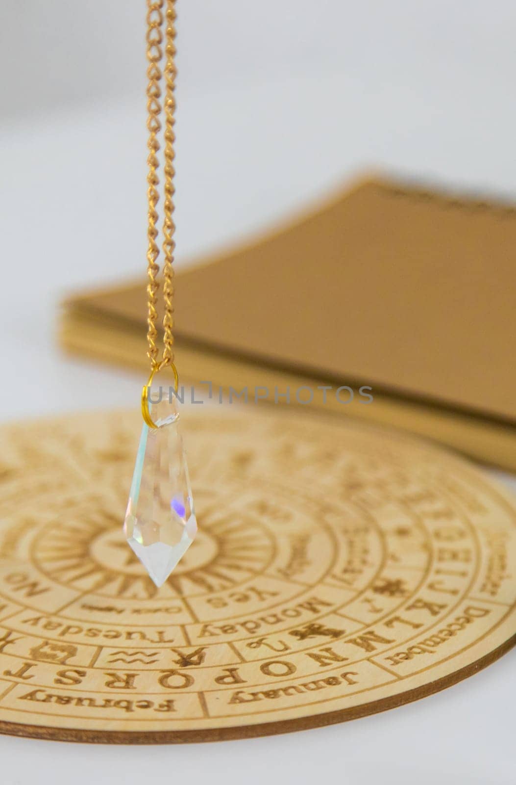 Pendulum numerologist astrologer and zodiac signs. Selective focus. Nature.