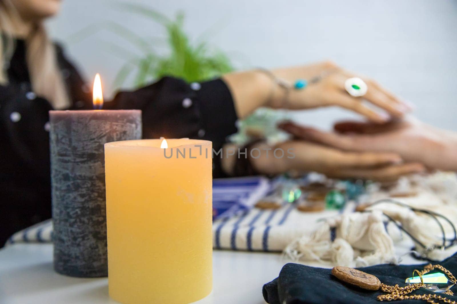 A fortune teller reads with tarot cards. Selective focus. Woman.