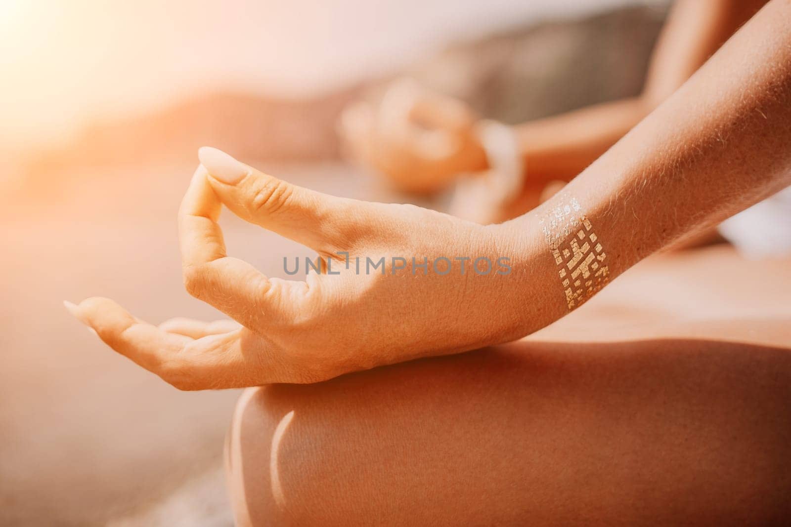 Woman sea yoga. Back view of free calm happy satisfied woman with long hair standing on top rock with yoga position against of sky by the sea. Healthy lifestyle outdoors in nature, fitness concept.