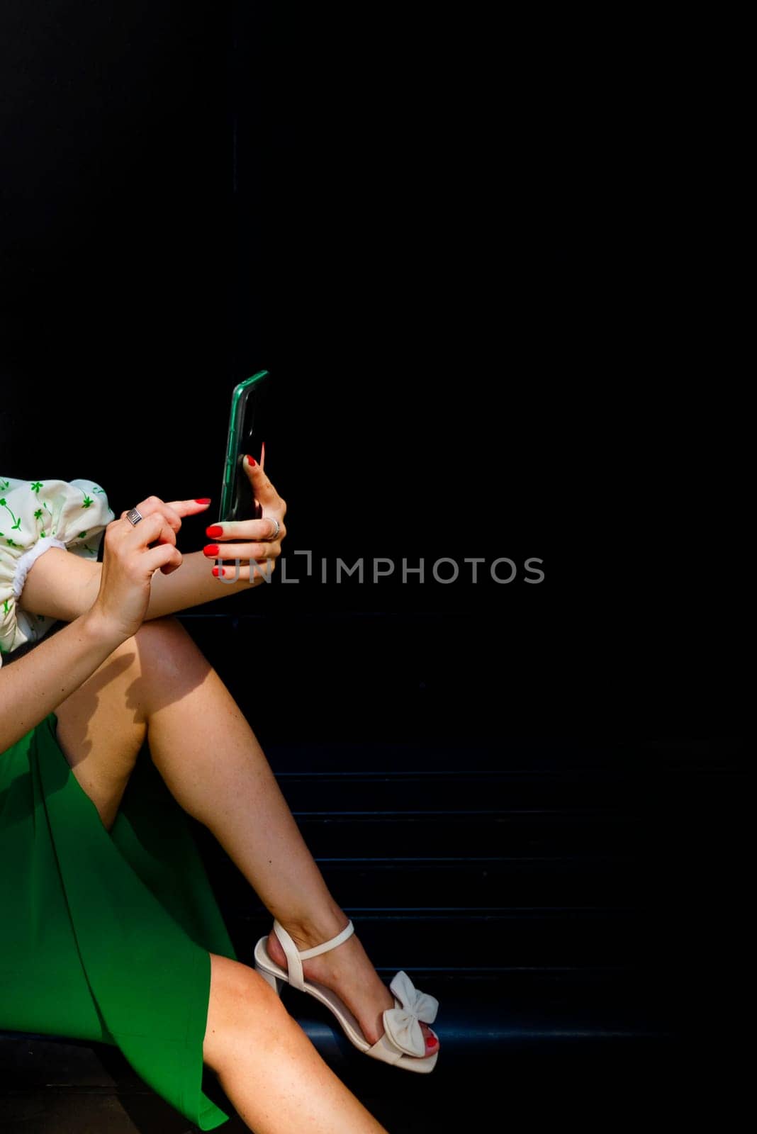 attractive female reacts to a text message. High quality photo