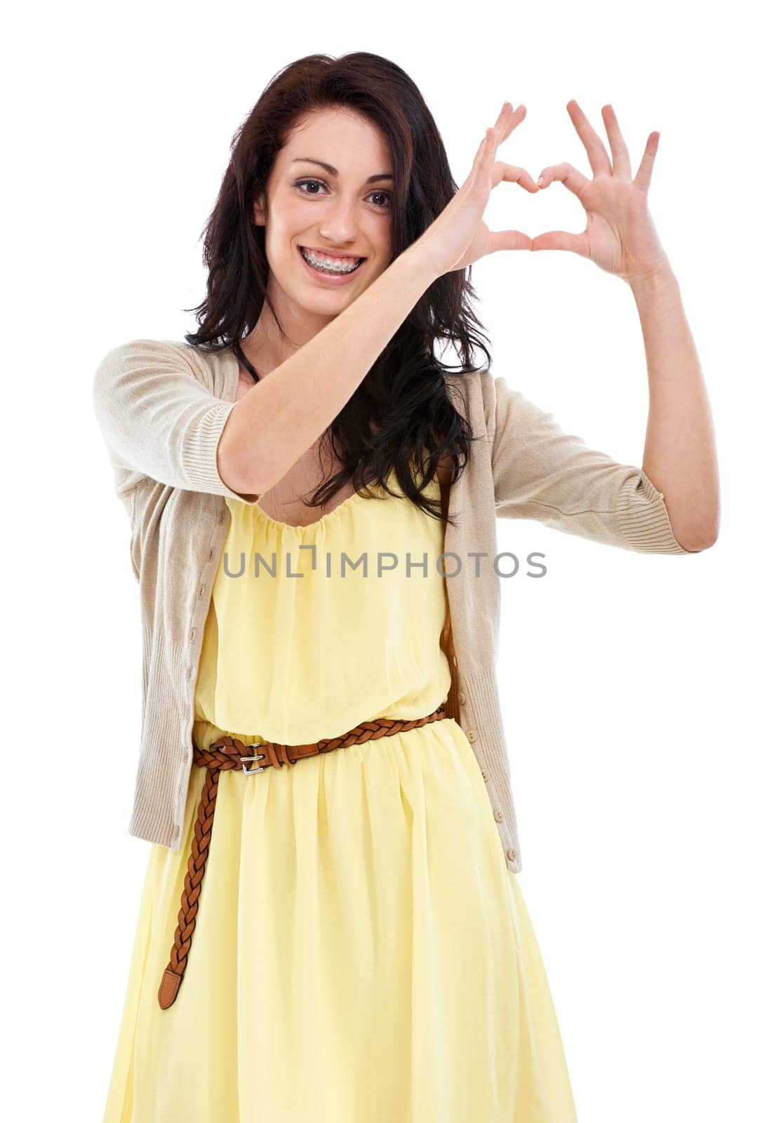Woman, portrait and heart hands for thank you in studio, kindness and peace emoji or symbol. Happy female person, support icon and smiling on white background, romance emoticon and gratitude for care.