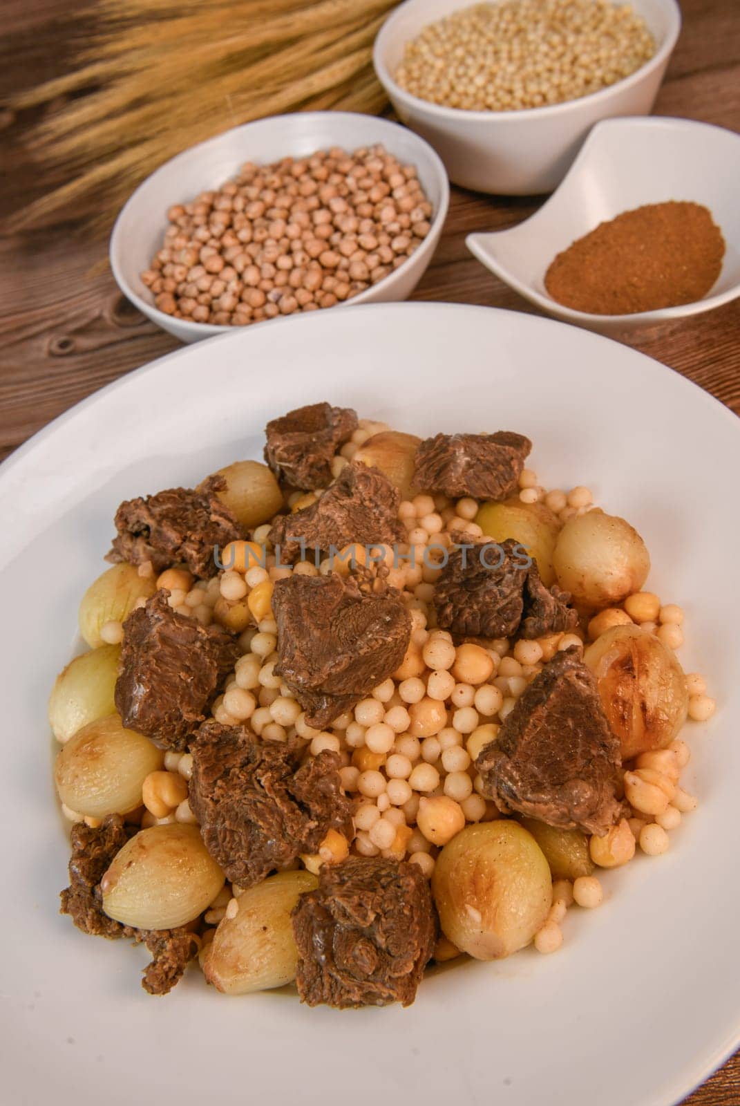 Moughrabieh is a popular dish, LEBANESE RECIPE FOR MOUGHRABIEH WITH BEEF AND SMALL ONIONS, SEMOLINA PEARLS AND CHICKPEAS by FreeProd