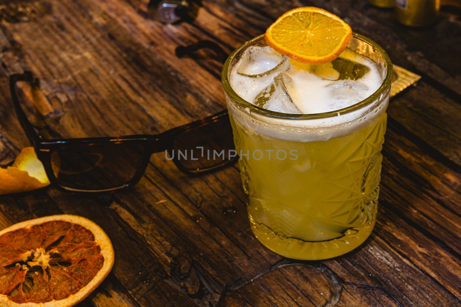 Whiskey Sour Drink Lighting on wooden table. Shallow dof