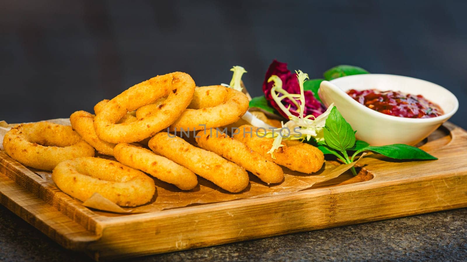 Homemade crunchy fried onion rings with tomato sauce by sarymsakov