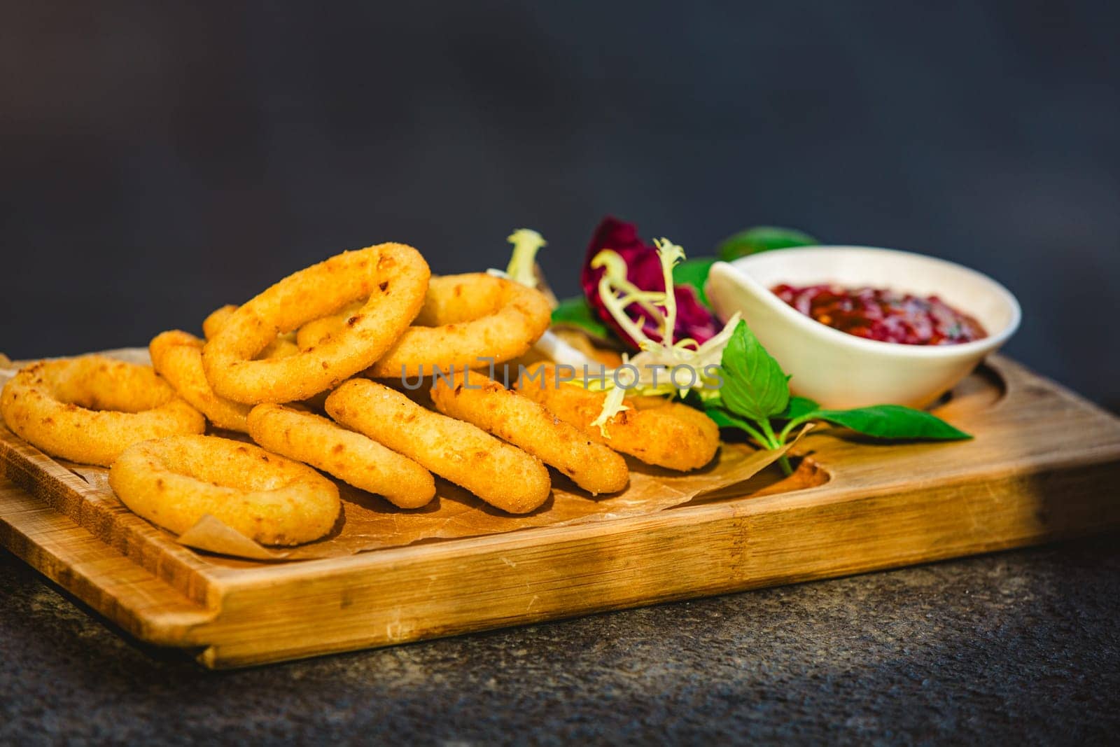 Homemade crunchy fried onion rings with tomato sauce by sarymsakov