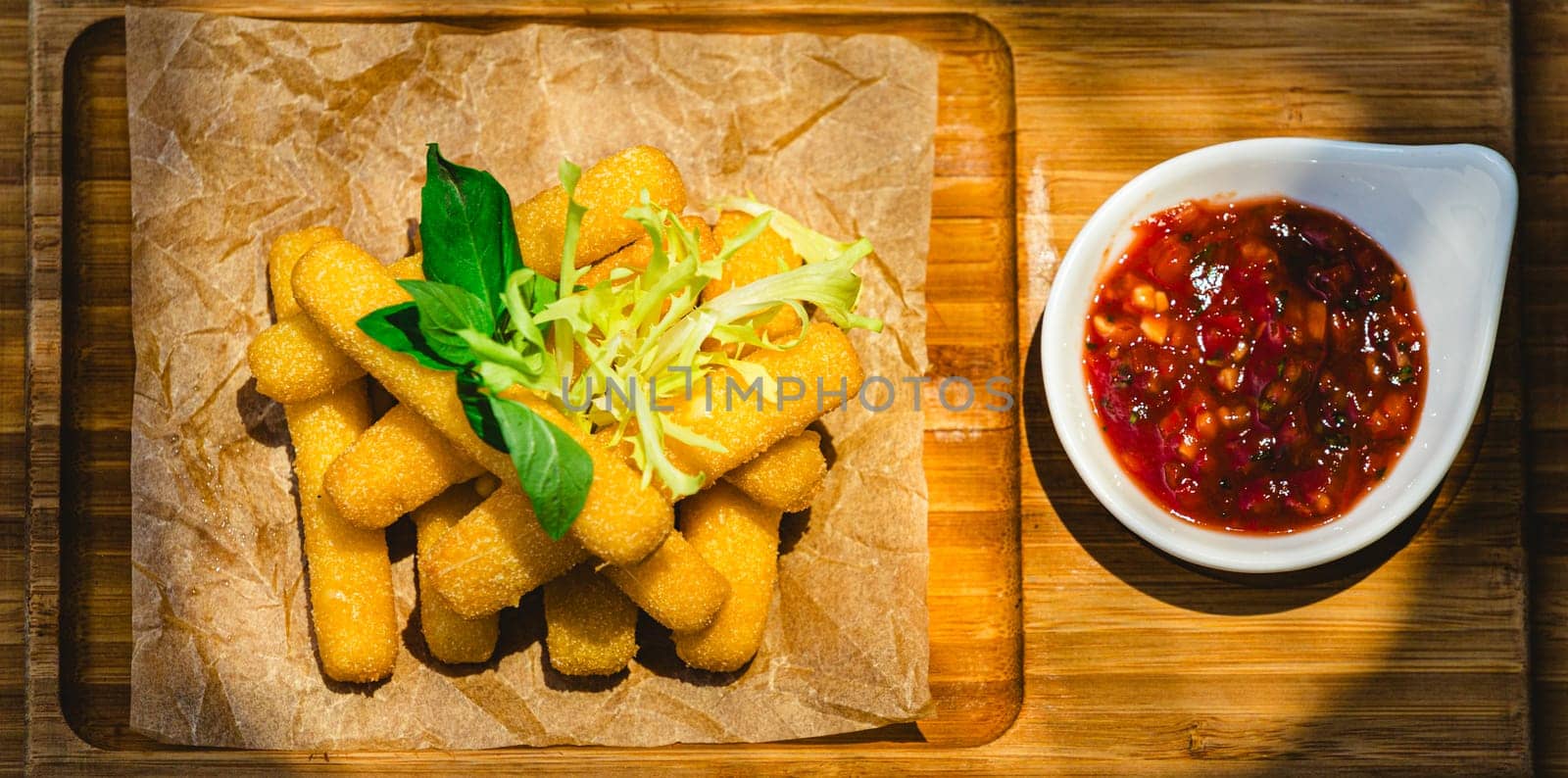 Crispy Halloumi cheese sticks with Chili sauce. Shallow dof.