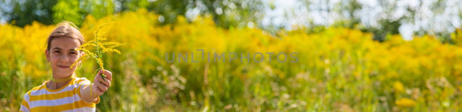 A child is allergic to ragweed blooming in the park. Selective focus. Nature.