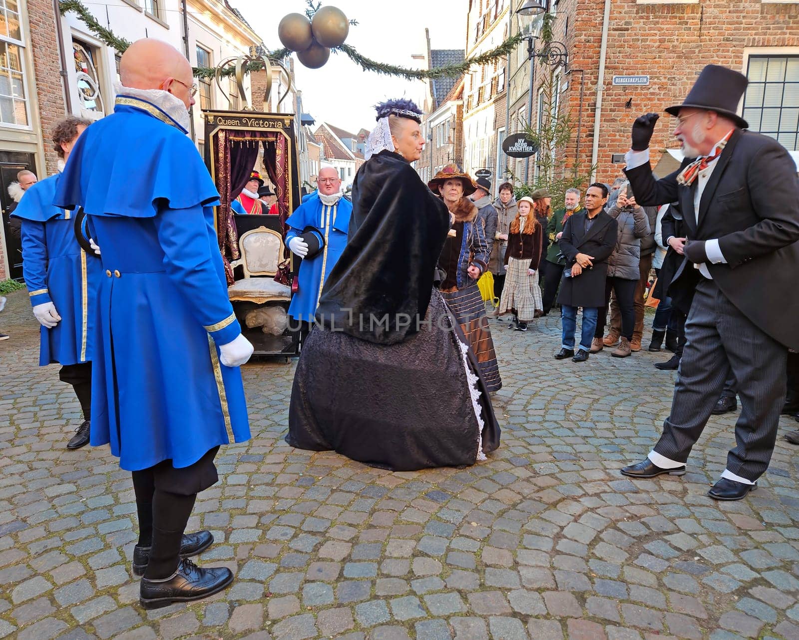 Deventer, Netherlands, December 16, 2023: Queen Victoria meets Charles Dickens during the Dickens festival in Deventer in the Netherlands