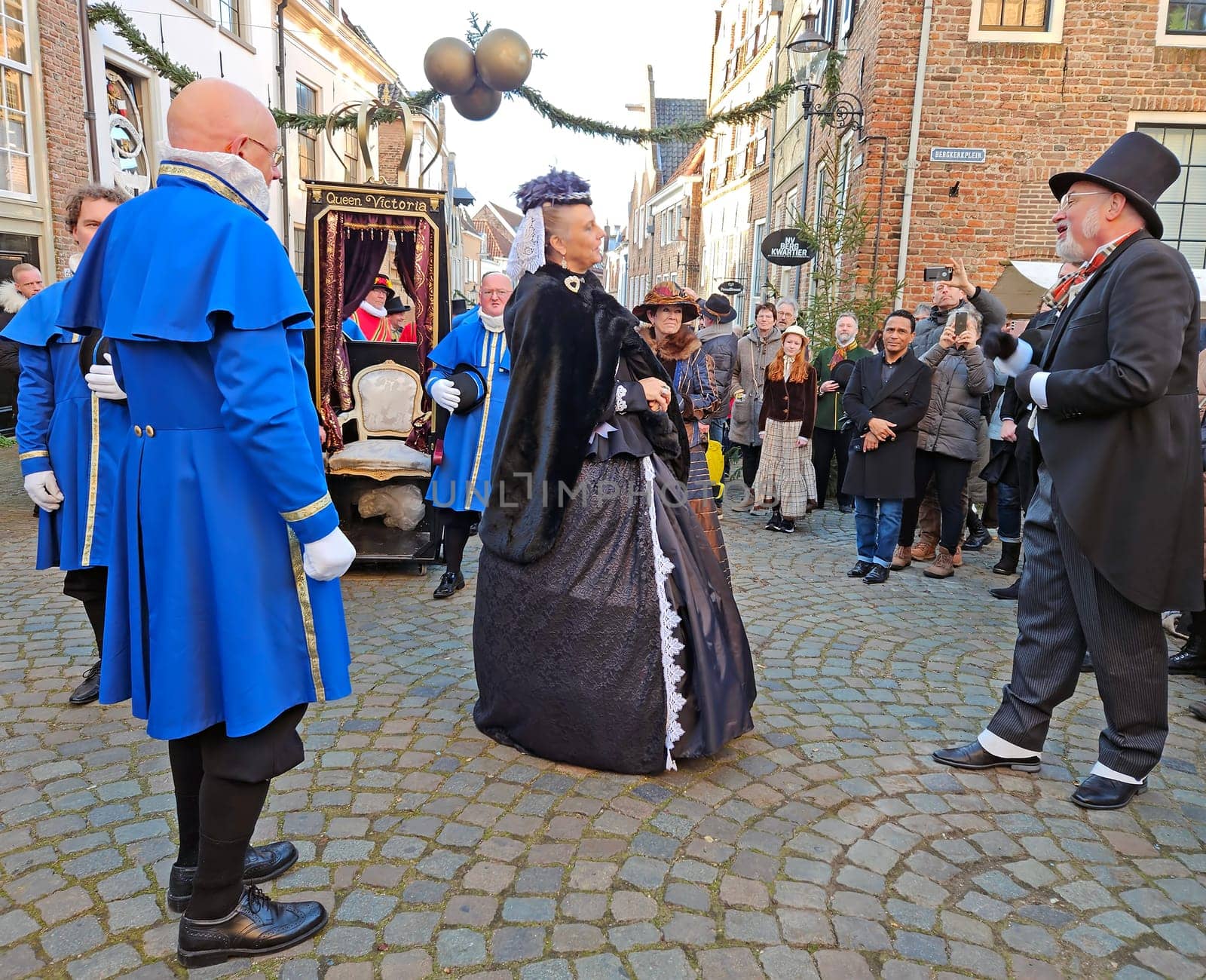 Deventer, Netherlands, December 16, 2023: Queen Victoria meets Charles Dickens during the Dickens festival in Deventer in the Netherlands