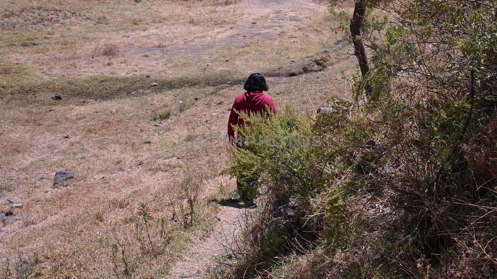 A man walking through the field