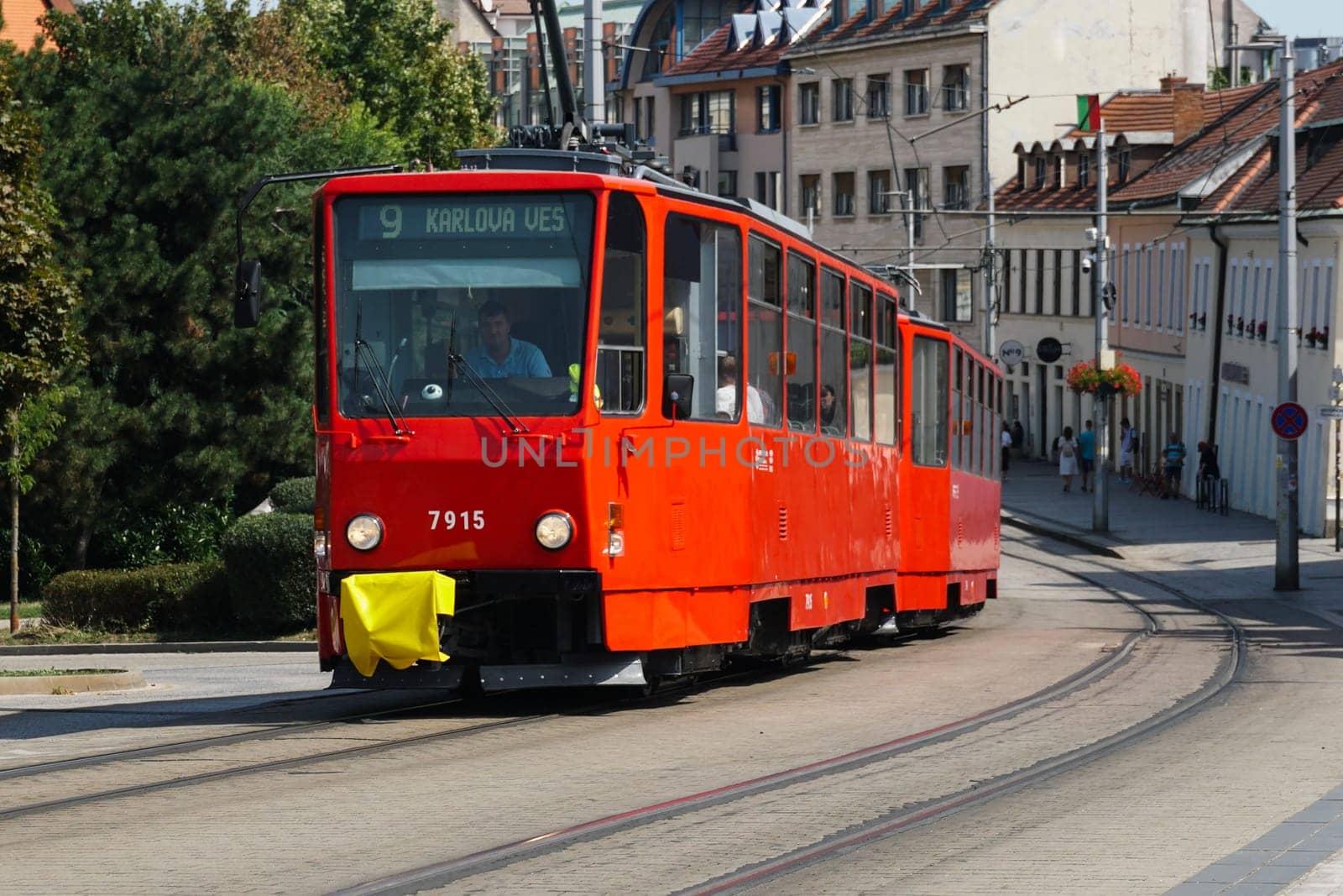 Bratislava, Slovakia - August 25, 2023: Tram riding with passengers in the streets by stan111