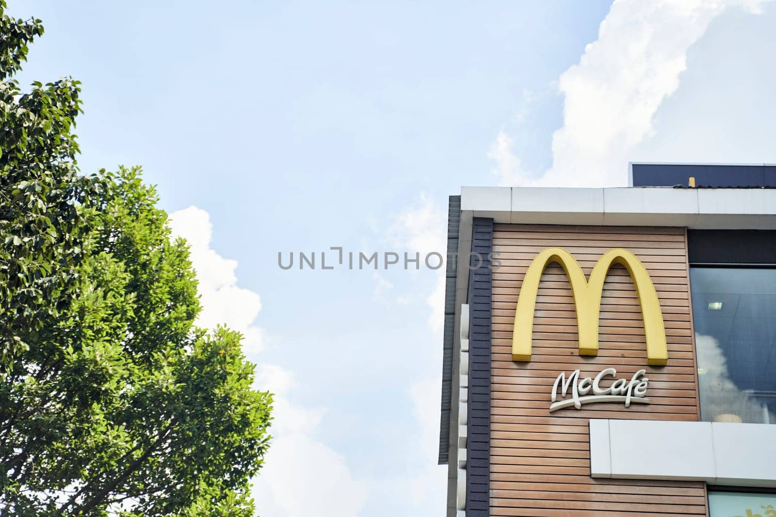 Ho Chi Minh City, Vietnam - 2.07.2023: Close-up of McDonald's logo and maccafe on building. High quality photo