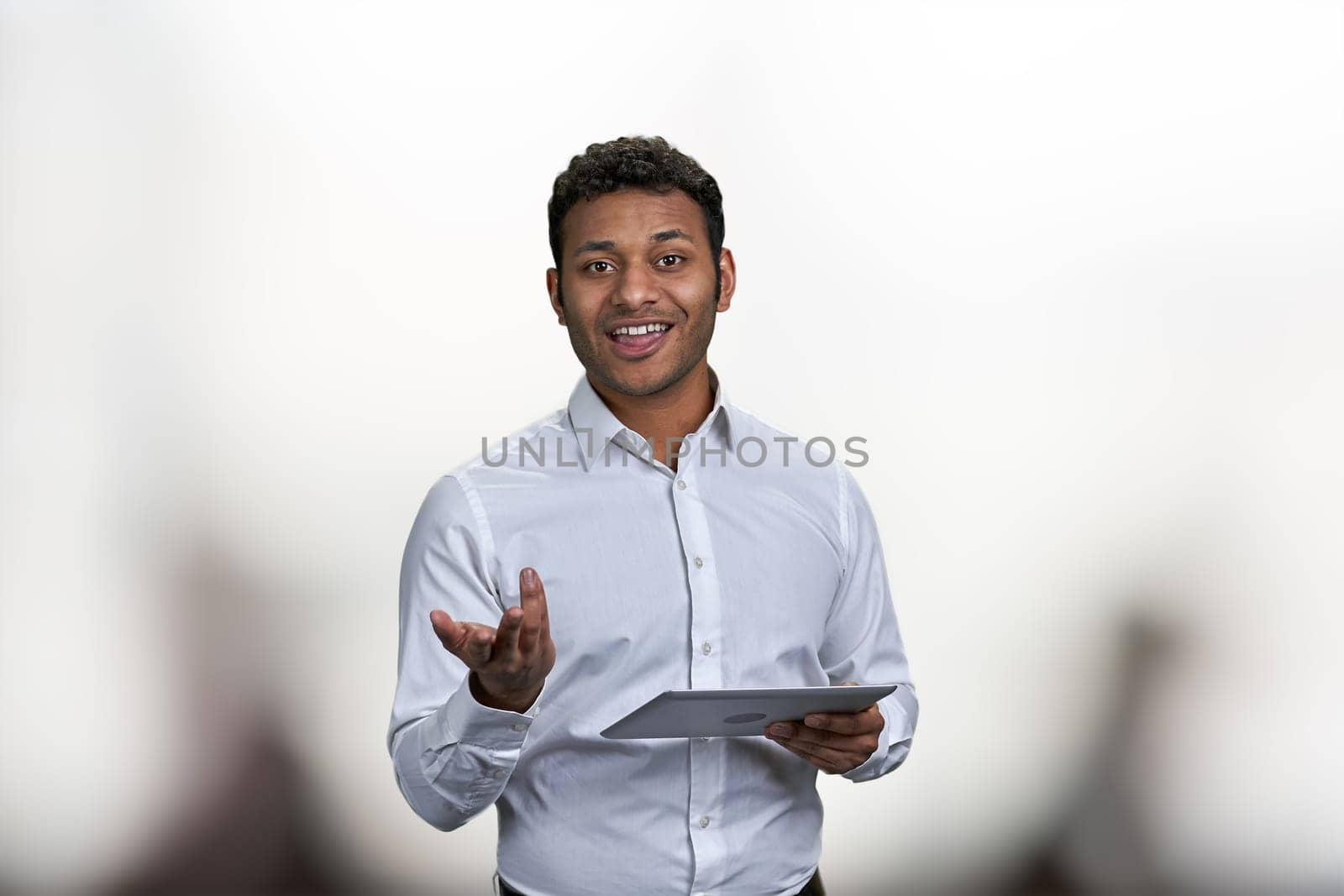 Smiling business trainer holding digital tablet and looking at camera. People, business and modern technology concept.