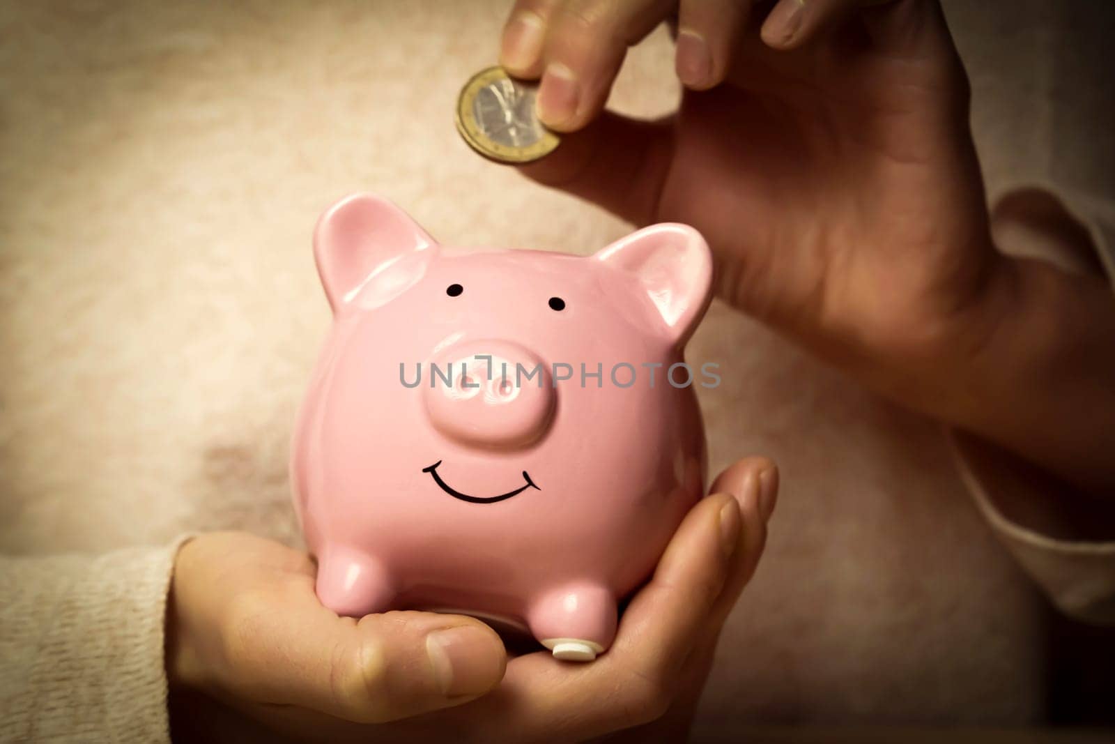 Girl preserve savings with piggy bank. by africapink