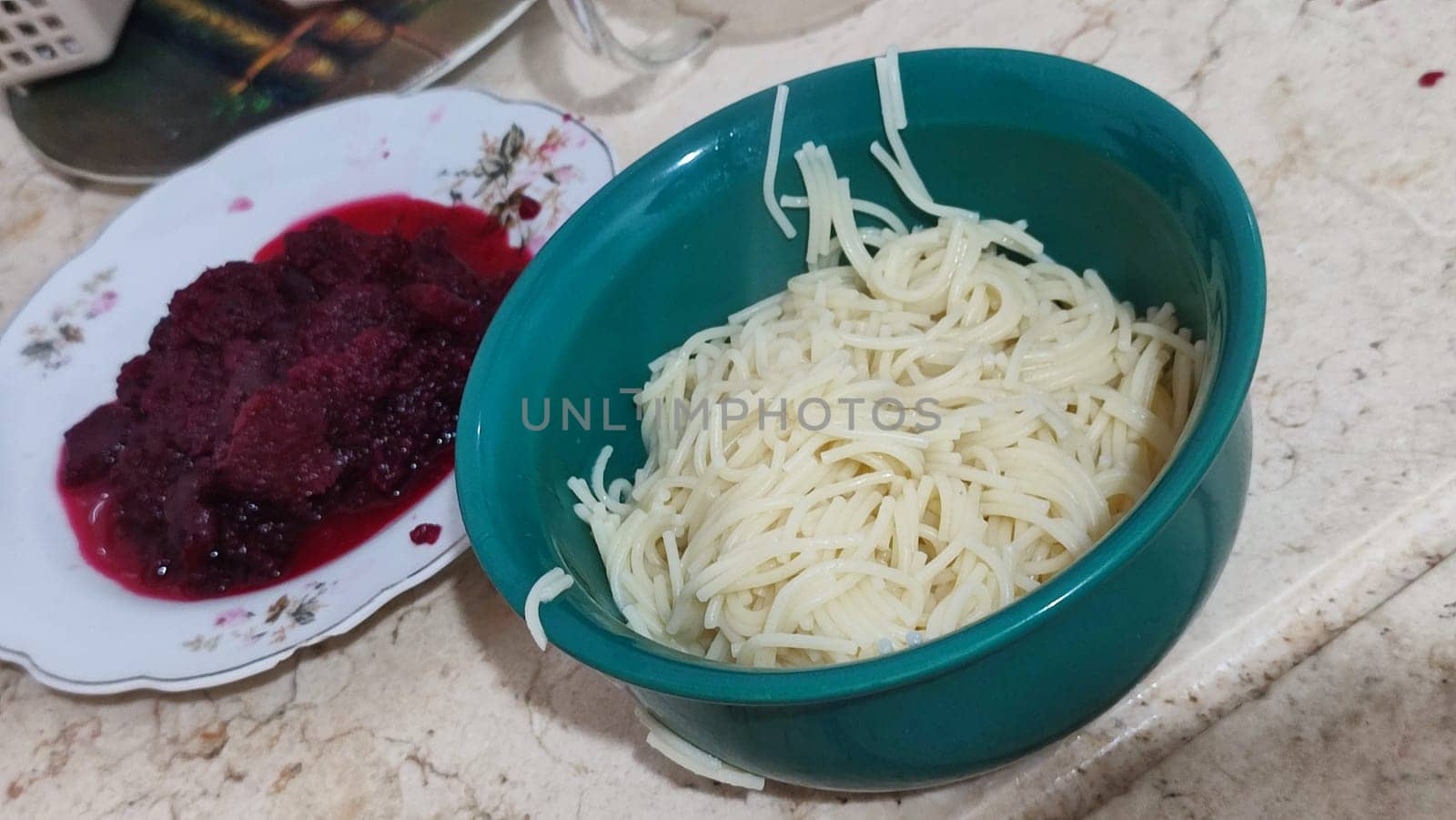 vermicelli in a green plate food, boiled beets. High quality photo
