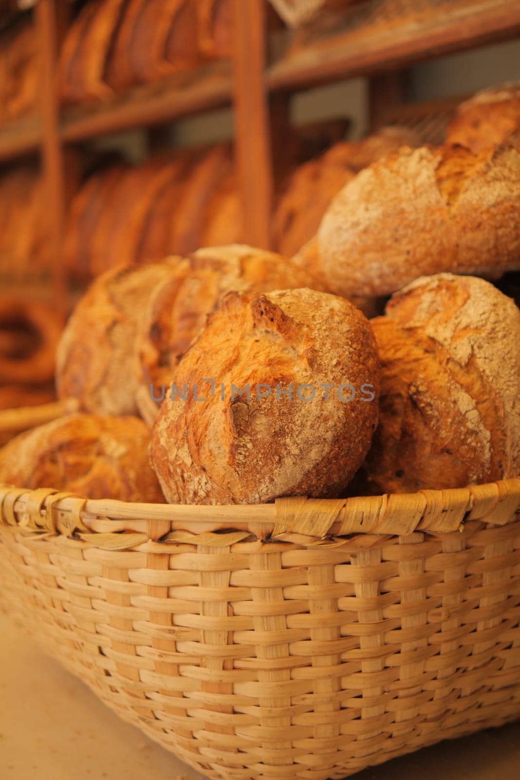 Bread baguettes in a basket in the baking shop. High quality photo