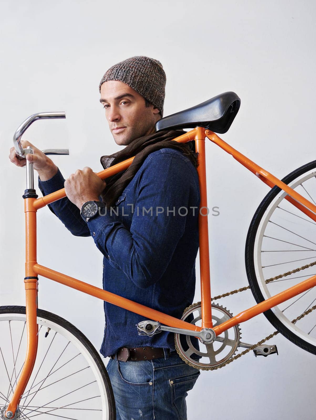 Man, studio and bicycle for sustainability, exercise and transportation on white background. Hipster cyclist, carbon neutral and eco friendly travel for environmental commute or fitness and trip.