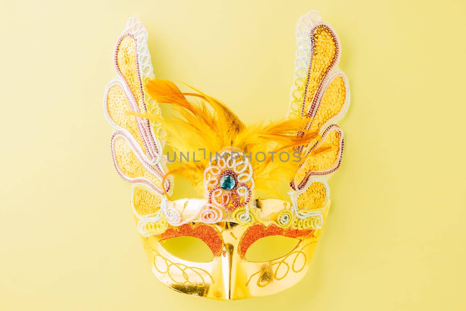 Happy Purim carnival accessories. Carnival mask for Mardi Gras celebration isolated on pastel green background, jewish holiday, Purim in Hebrew holiday carnival ball, Venetian mask