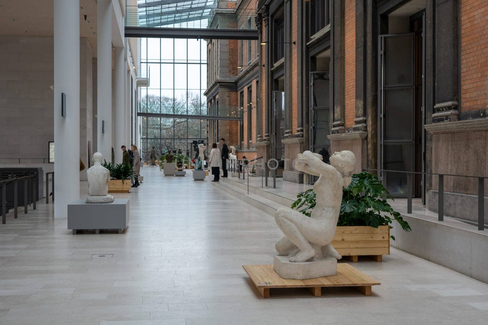 Copenhagen, Denmark - January 20, 2024: Sculptures and people inside the National Gallery of Denmark