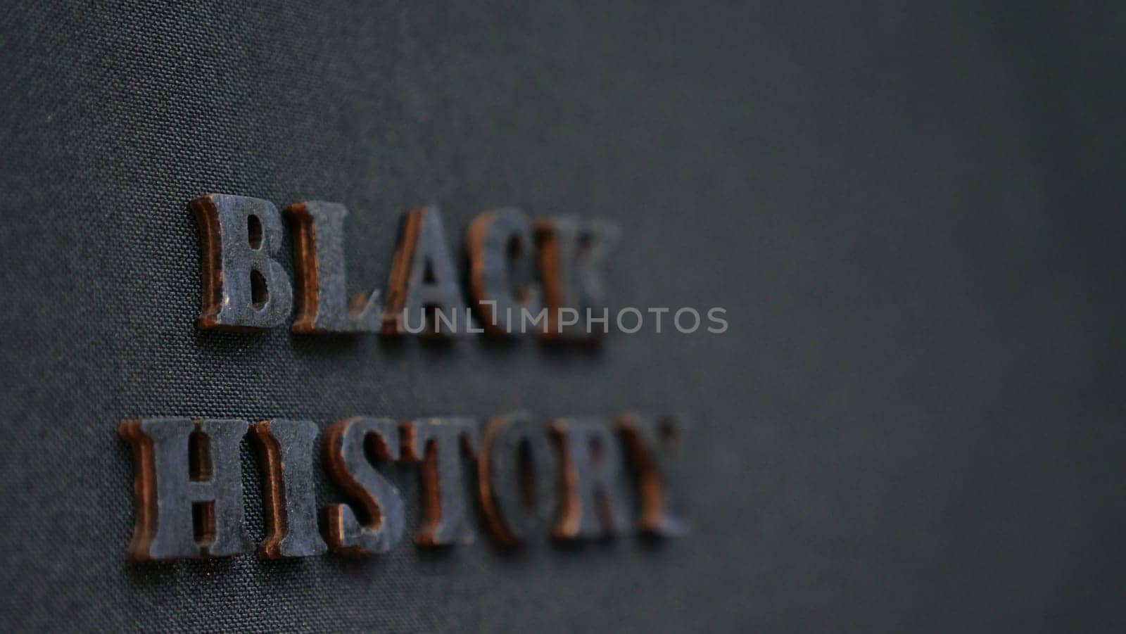 Inscription text Black History Month on dark isolated background close up. Celebrating the African American Conceptual Holiday for Equality