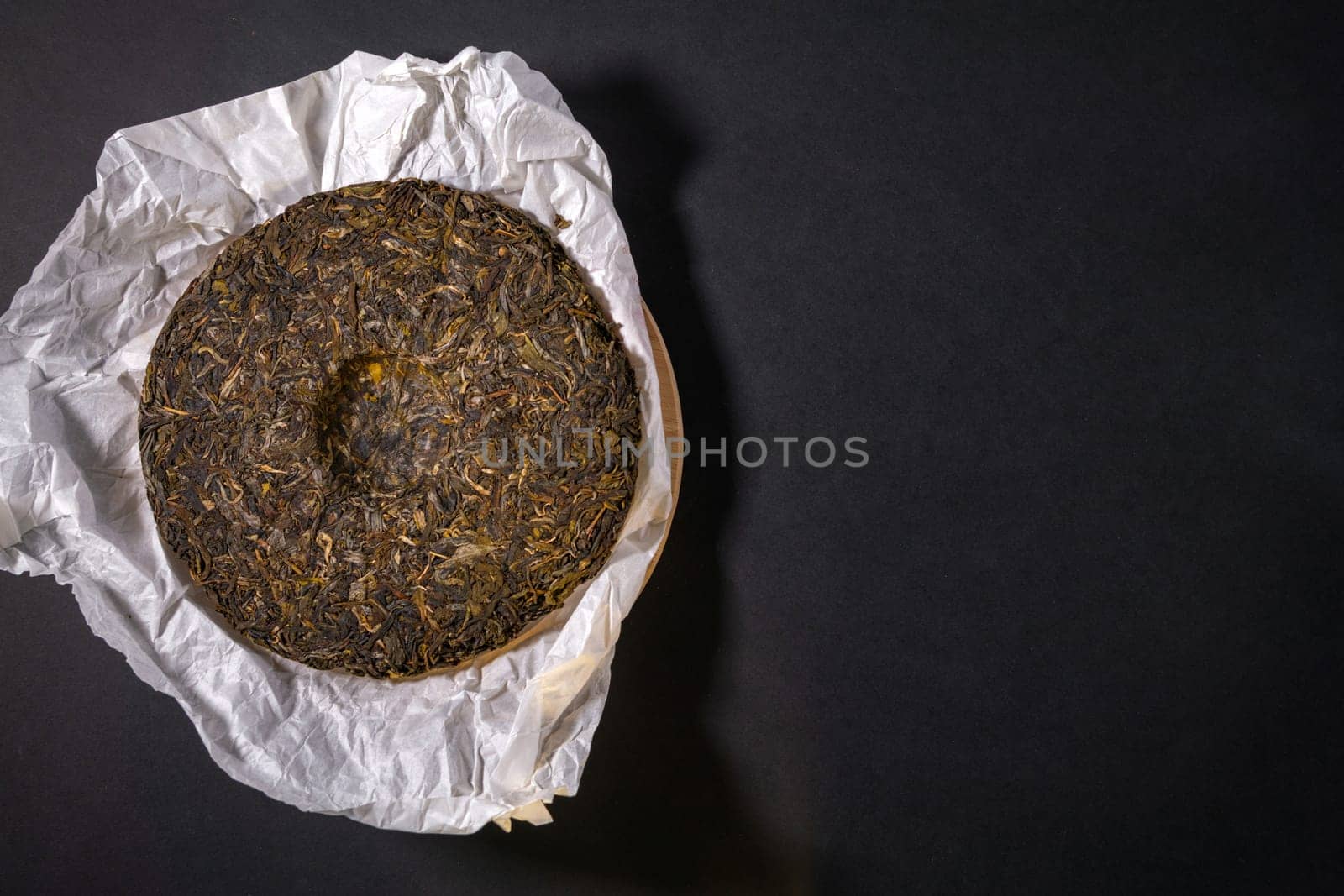Chinese Puerh tea in the package. the Chinese dry the tea. the view from the top. Shen PUerh, Shu puer. Copy space by darksoul72