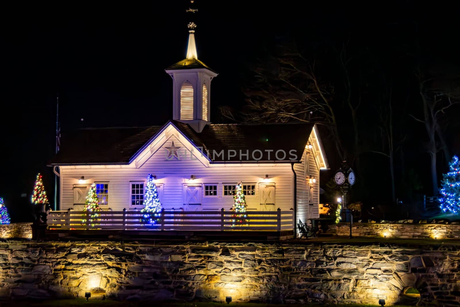 Quaint White Chapel Adorned With Twinkling Christmas Lights And Festive Decorations, Nestled Against A Night Sky, Radiating A Sense Of Peace And Holiday Cheer.