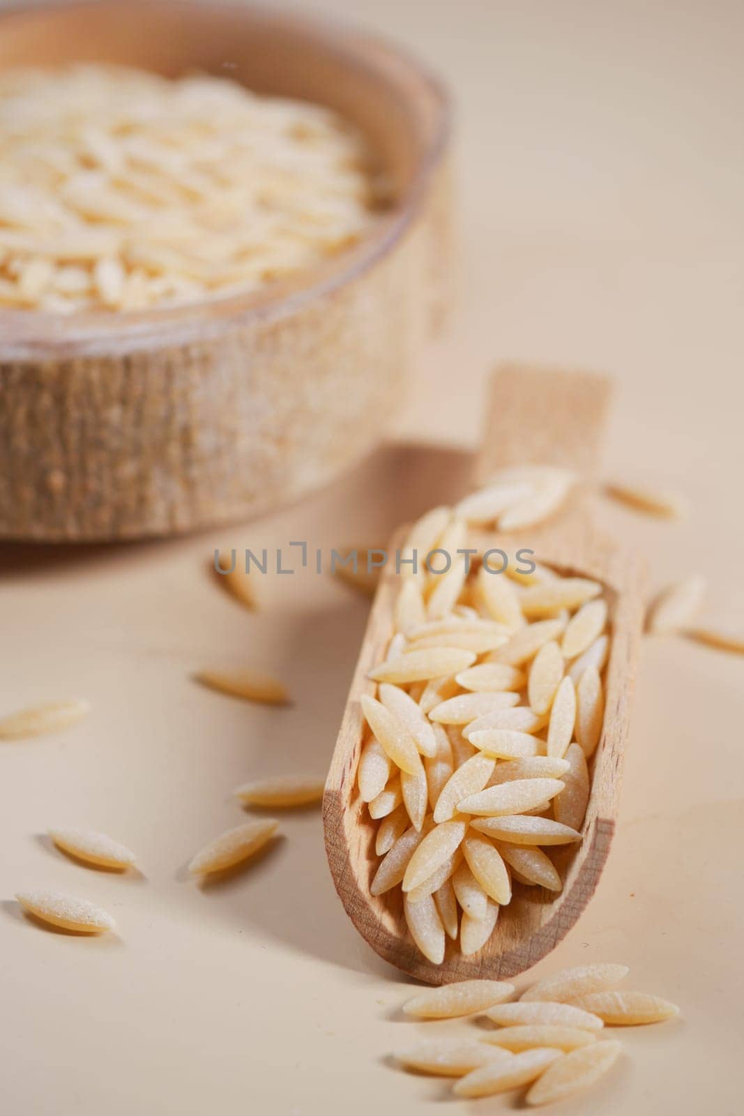 Wooden bowl with white long rice basmati