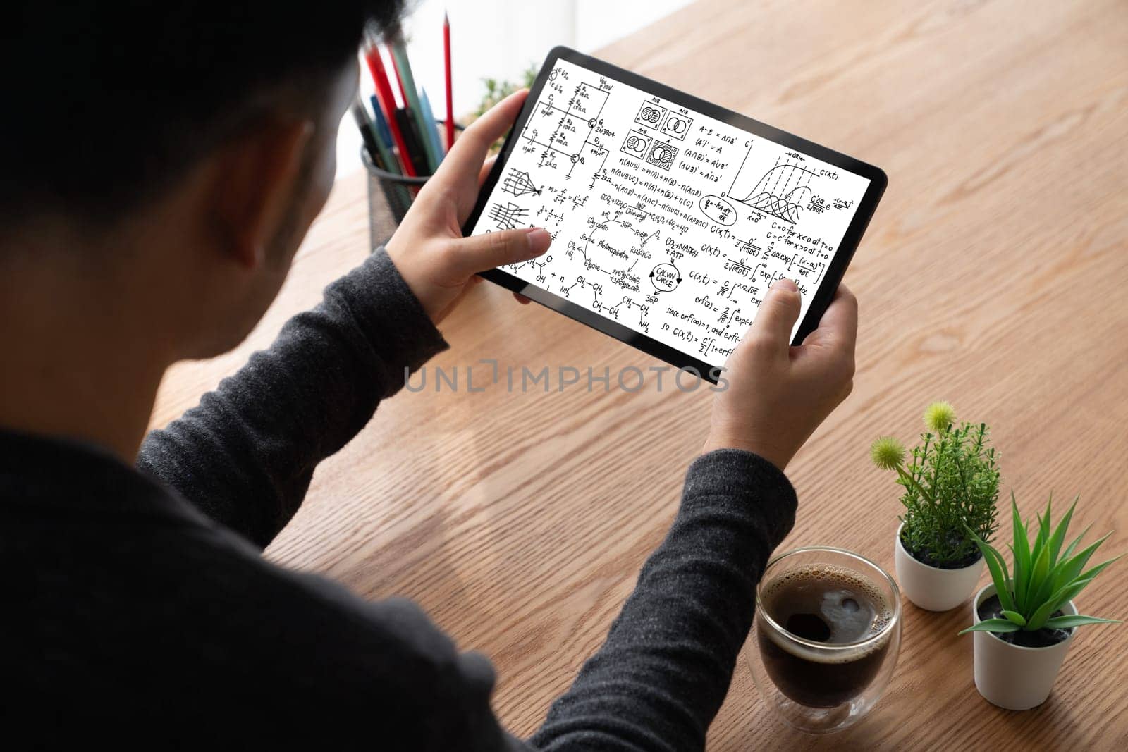 Mathematic equations and modish formula on computer screen showing concept of science and education