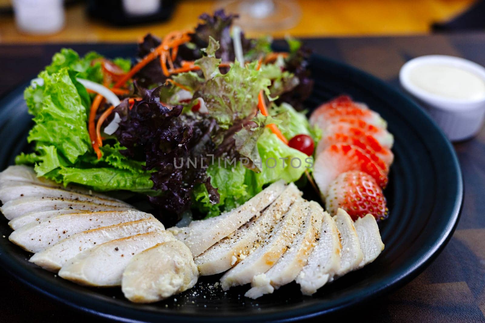 Grilled Chicken Fillet And Fresh Green Leafy Vegetable Salad With Strawberry by urzine