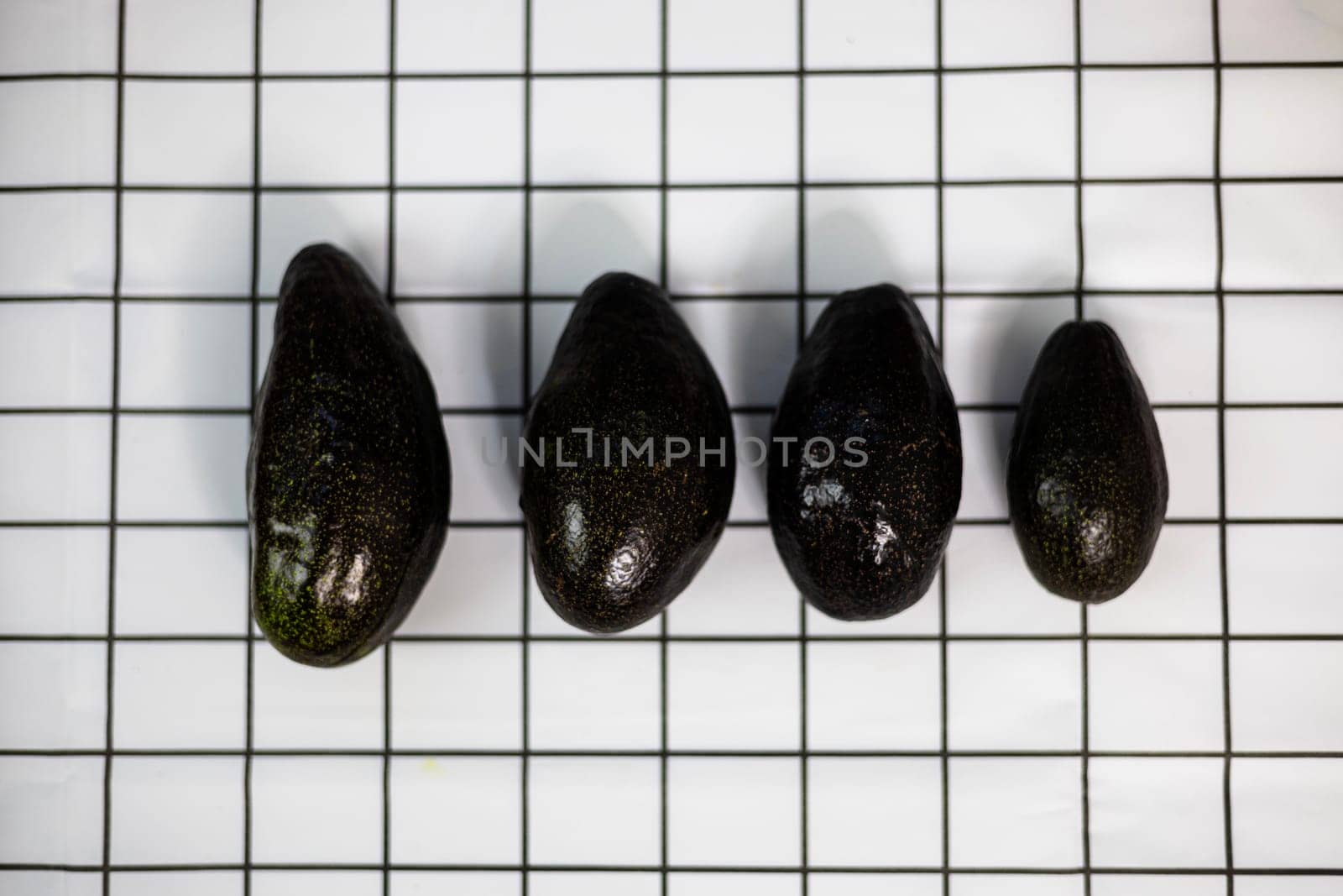 Ripe brown avocados placed together. Top view.