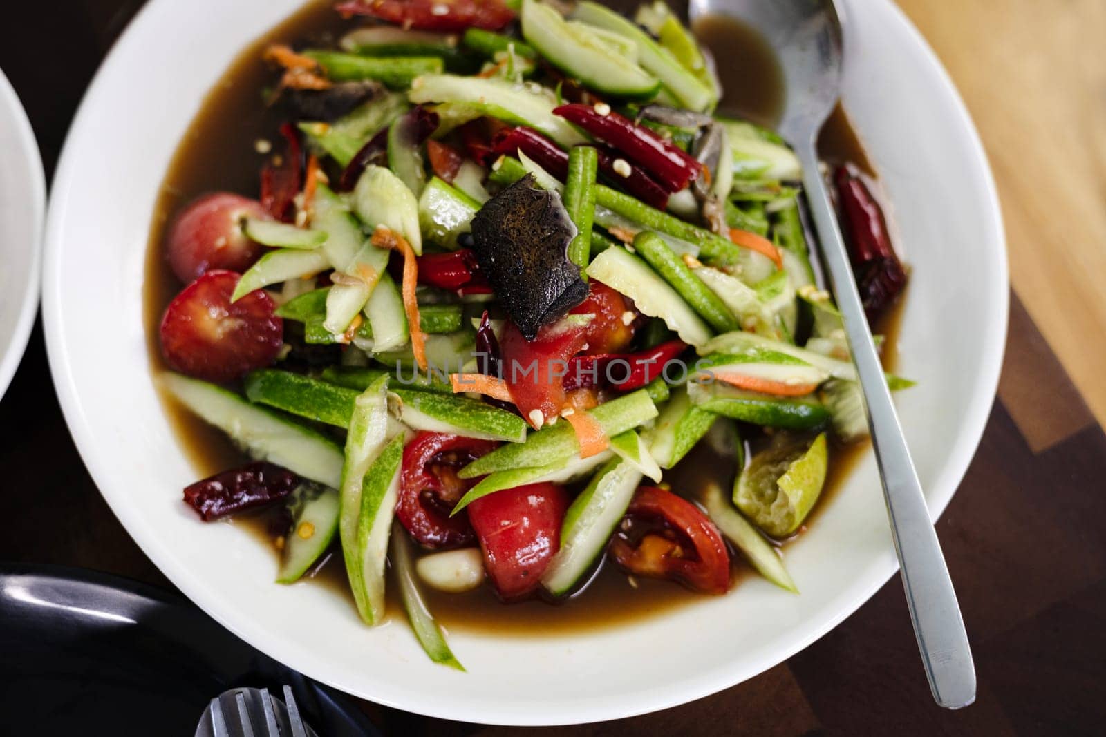 Spicy Cucumber Salad In Plate by urzine
