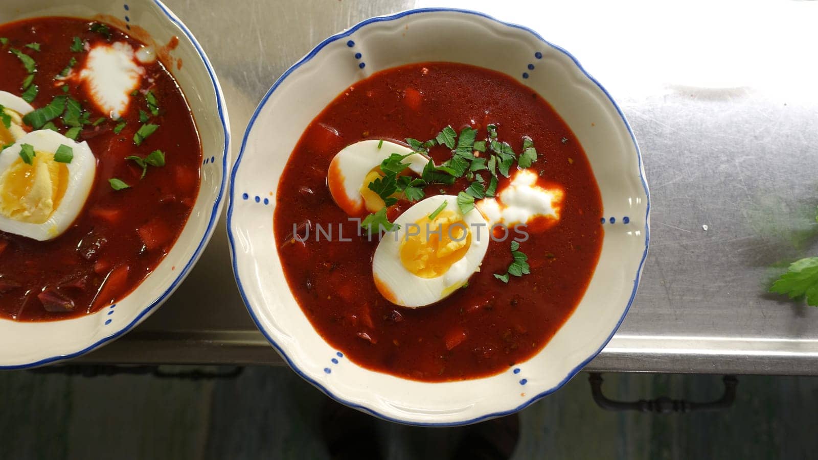 Homemade soup with tomatoes, beetroot, cream eggs and parsley. by Jamaladeen