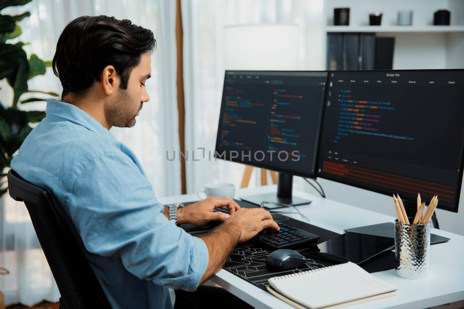 Smart IT developer working software development coding with creating application program update version online website on data's company system two computer code pc screen at modern office. Surmise.