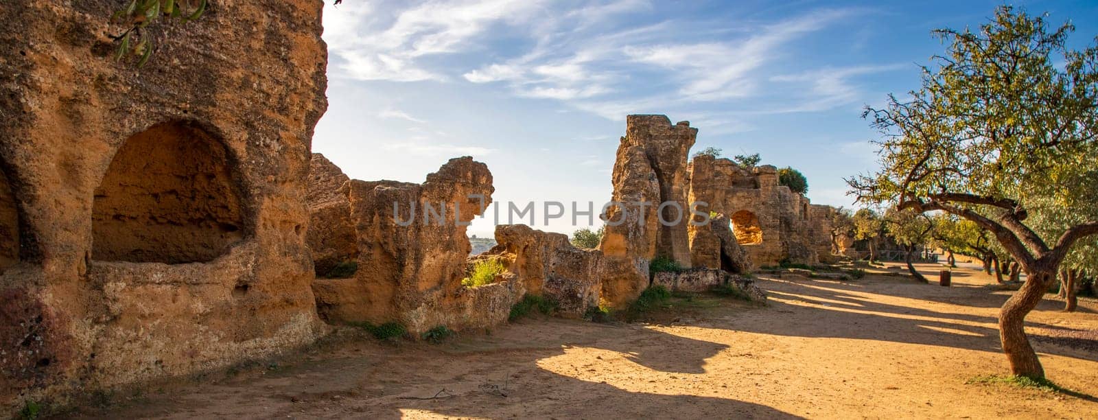 The historical walls with archs around the complex of Valley of the Temples