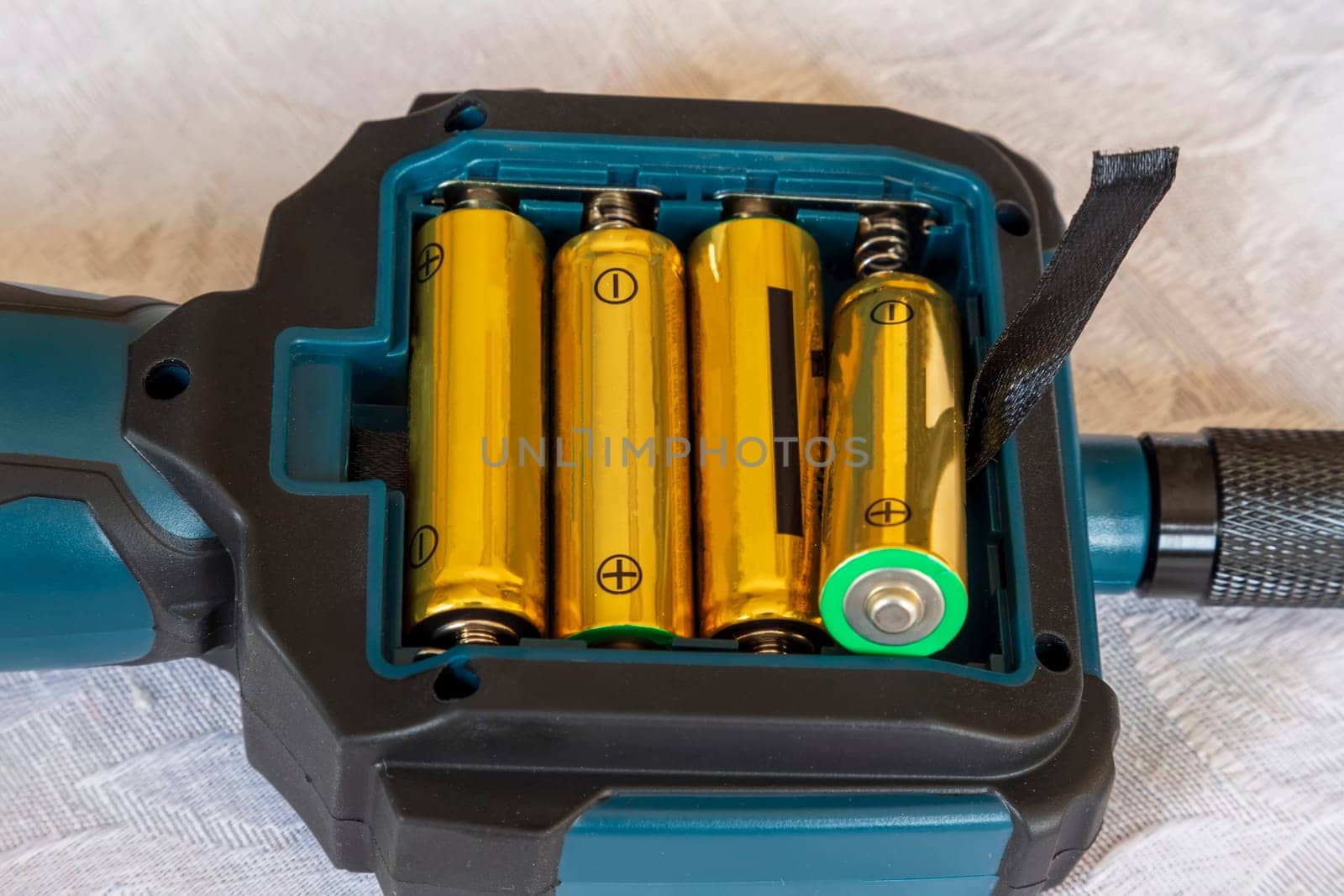 putting new batteries in a device or replacement