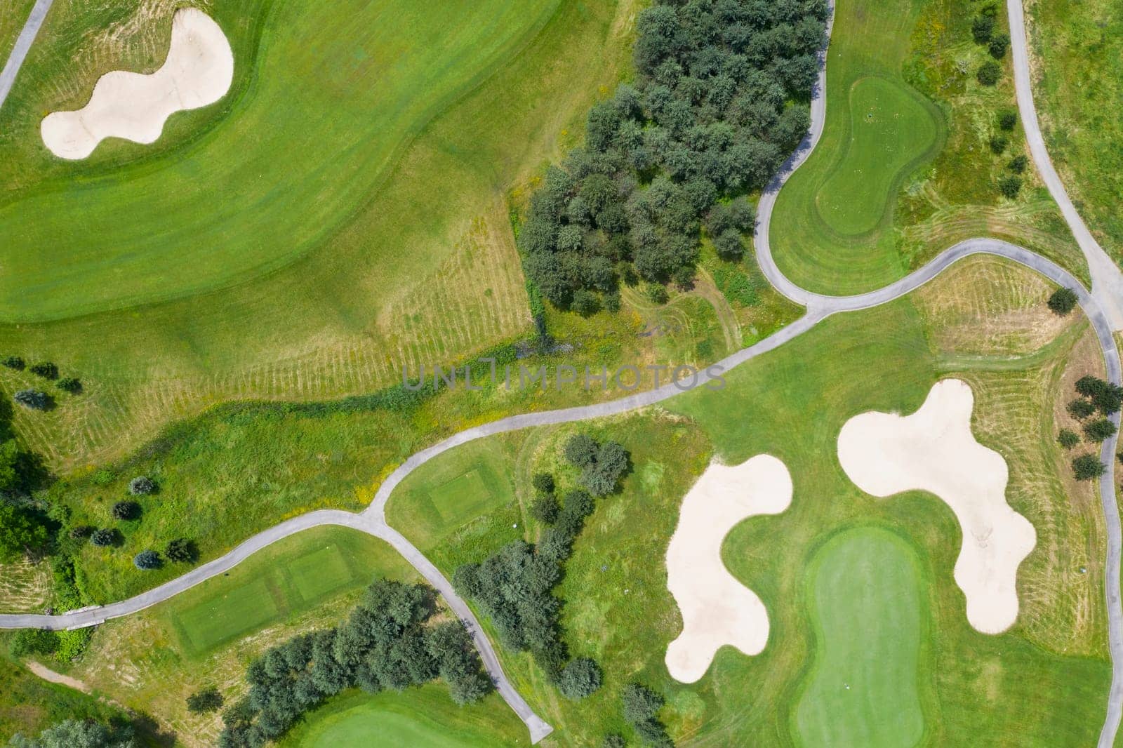 Landscape in a golf course an aerial view of a green field, lawn, and grass.  by EdVal