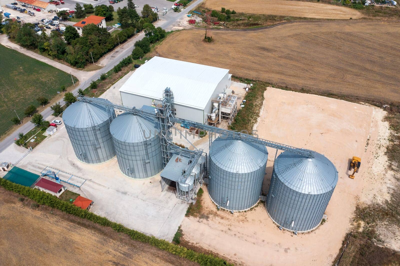 Modern agricultural Silo from above. Set of storage tanks cultivated agricultural crops processing plant. 