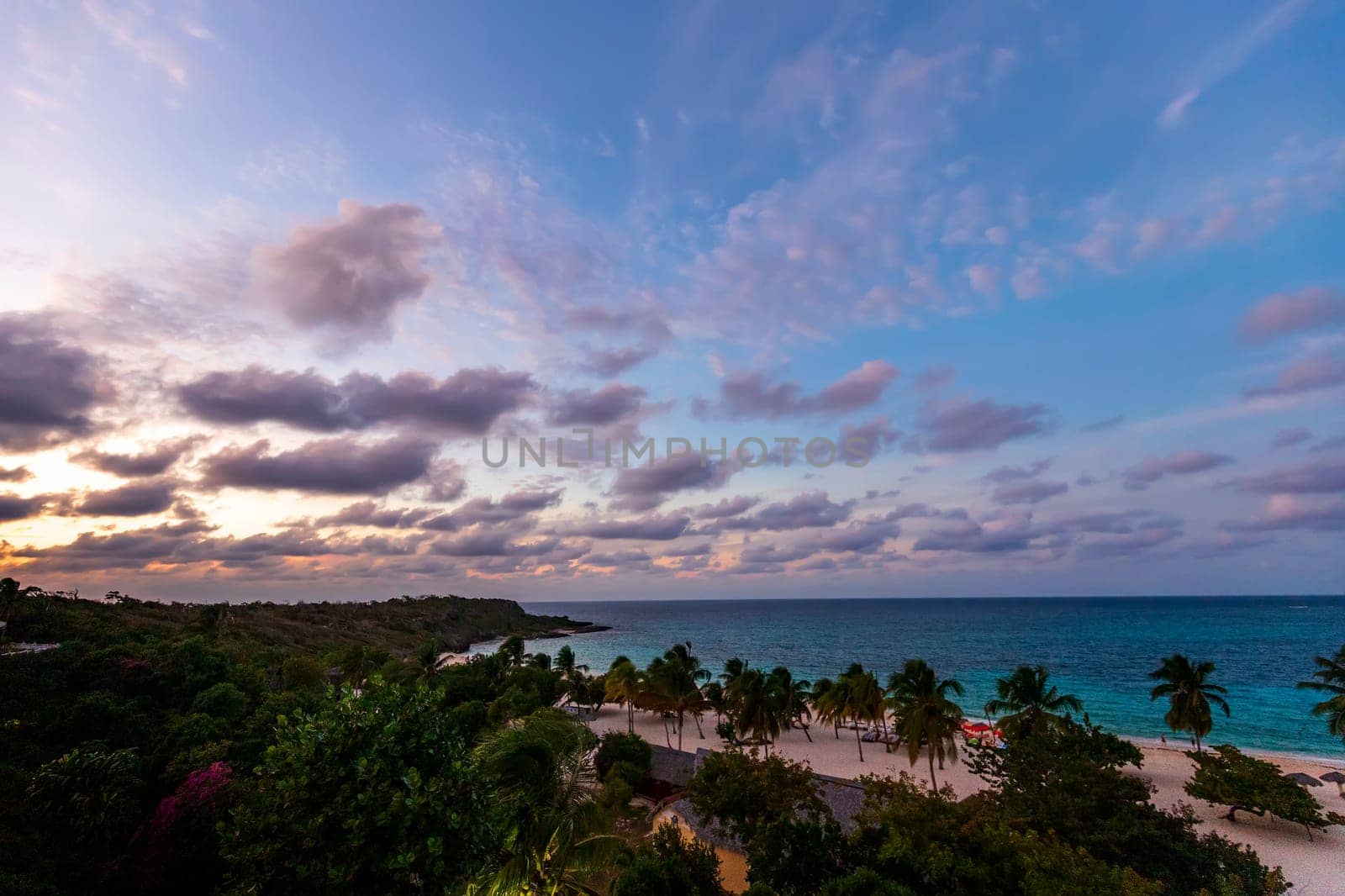 Tropical sunset on the beach. Guardalavaca, Cuba by EdVal