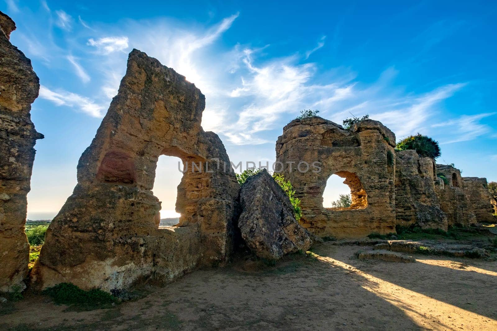 The historical walls with archs around the complex of Valley of the Temples by EdVal