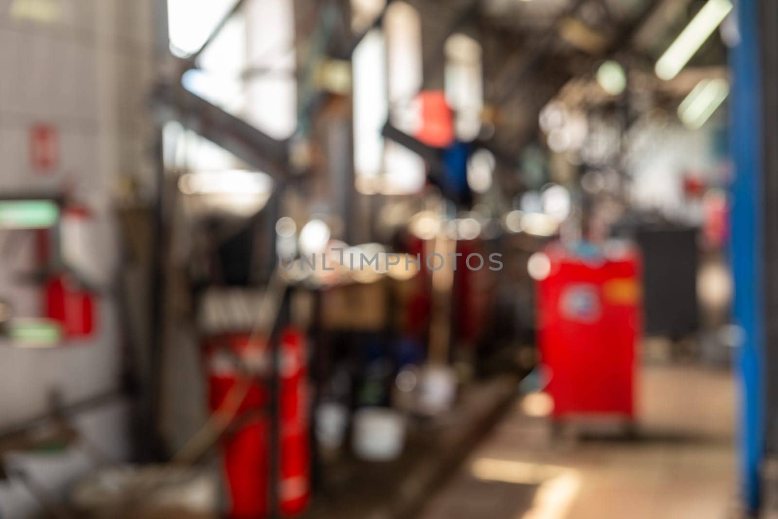 Blurred background image with cars in automobile repair service by BY-_-BY